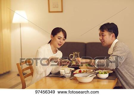 Stock Photo - Japanese couple at home. Fotosearch