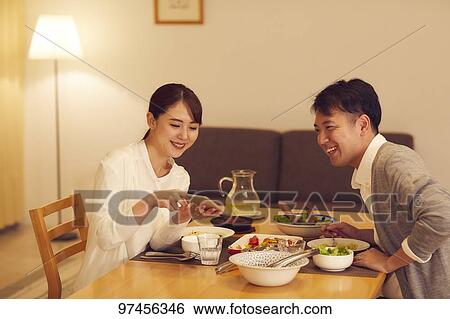 Stock Photograph - Japanese couple at home. Fotosearch