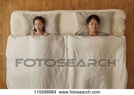 Japanese couple in bed View Large Photo Image Picture - Japanese couple in bed. Fotosearch