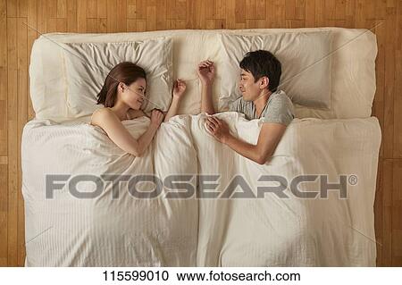 Japanese couple in bed View Large Photo Image Stock Image - Japanese couple in bed. Fotosearch