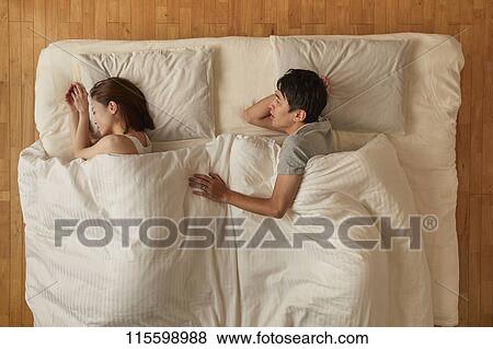 Japanese couple in bed View Large Photo Image Stock Photo - Japanese couple in bed. Fotosearch
