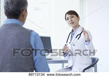 Japanese doctor at work View Large Photo Image Picture - Japanese doctor at work. Fotosearch