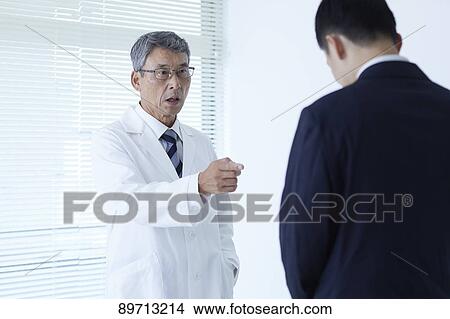 Japanese doctor at work View Large Photo Image Picture - Japanese doctor at work. Fotosearch