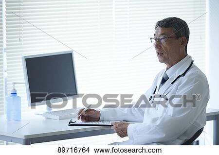 Japanese doctor at work View Large Photo Image Picture - Japanese doctor at work. Fotosearch
