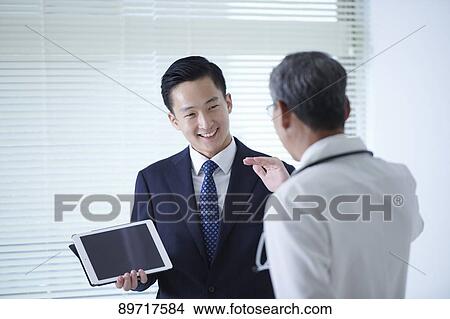 Japanese doctor at work View Large Photo Image Picture - Japanese doctor at work. Fotosearch