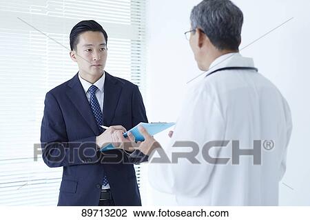 Japanese doctor at work View Large Photo Image Stock Image - Japanese doctor at work. Fotosearch