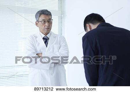 Japanese doctor at work View Large Photo Image Stock Image - Japanese doctor at work. Fotosearch