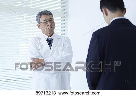 Japanese doctor at work View Large Photo Image Stock Image - Japanese doctor at work. Fotosearch