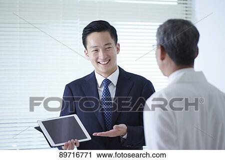 Japanese doctor at work View Large Photo Image Stock Image - Japanese doctor at work. Fotosearch