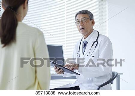 Stock Photo - Japanese doctor at work. Fotosearch