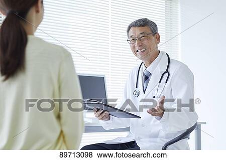 Japanese doctor at work View Large Photo Image Stock Photo - Japanese doctor at work. Fotosearch