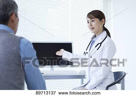 Japanese doctor at work View Large Photo Image Stock Photo - Japanese doctor at work. Fotosearch