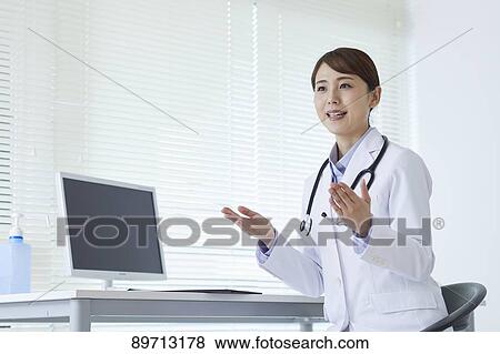 Japanese doctor at work View Large Photo Image Stock Photo - Japanese doctor at work. Fotosearch
