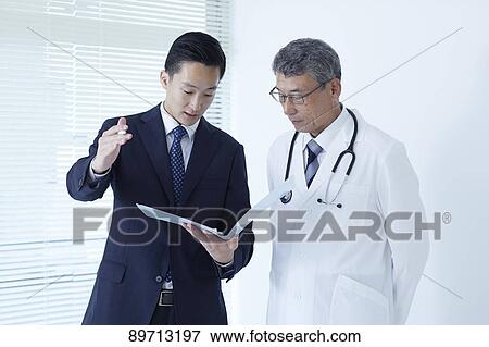 Japanese doctor at work View Large Photo Image Stock Photo - Japanese doctor at work. Fotosearch