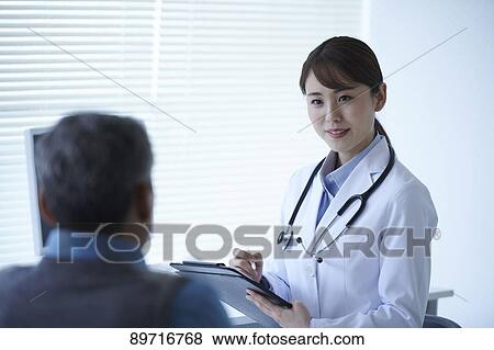 Japanese doctor at work View Large Photo Image Stock Photo - Japanese doctor at work. Fotosearch