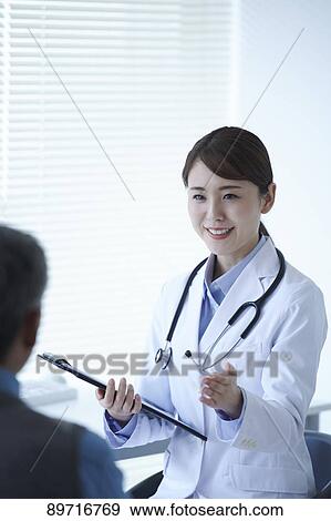 Japanese doctor at work View Large Photo Image Stock Photo - Japanese doctor at work. Fotosearch