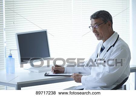 Japanese doctor at work View Large Photo Image Stock Photo - Japanese doctor at work. Fotosearch