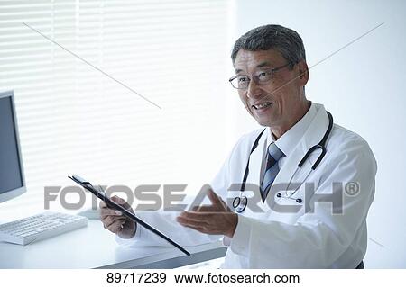 Japanese doctor at work View Large Photo Image Stock Photo - Japanese doctor at work. Fotosearch