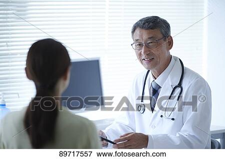 Stock Photo - Japanese doctor at work. Fotosearch