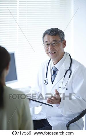 Stock Photo - Japanese doctor at work. Fotosearch