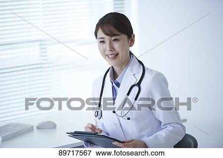 Japanese doctor at work View Large Photo Image Stock Photo - Japanese doctor at work. Fotosearch