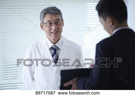 Japanese doctor at work View Large Photo Image Stock Photo - Japanese doctor at work. Fotosearch