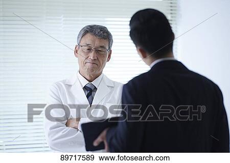 Japanese doctor at work View Large Photo Image Stock Photo - Japanese doctor at work. Fotosearch