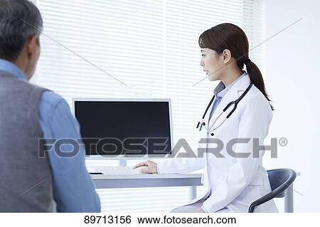 Stock Photograph - Japanese doctor at work. Fotosearch