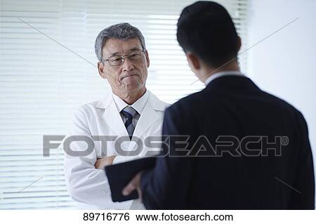 Japanese doctor at work View Large Photo Image Stock Photograph - Japanese doctor at work. Fotosearch