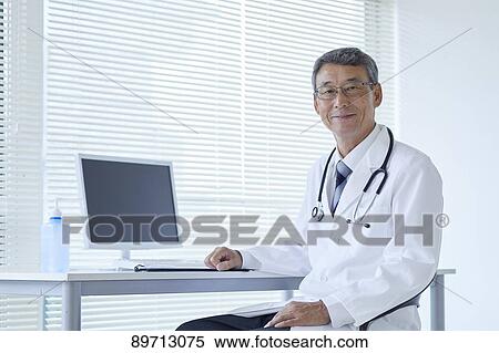 Japanese doctor at work View Large Photo Image Stock Photography - Japanese doctor at work. Fotosearch