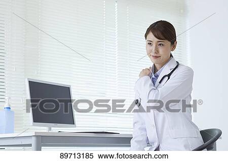 Stock Photography - Japanese doctor at work. Fotosearch