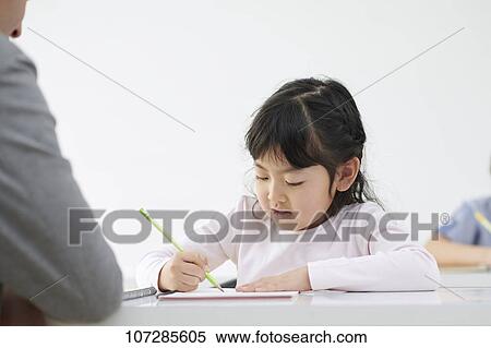 Stock Photography - Japanese elementary school kid with teacher. Fotosearch