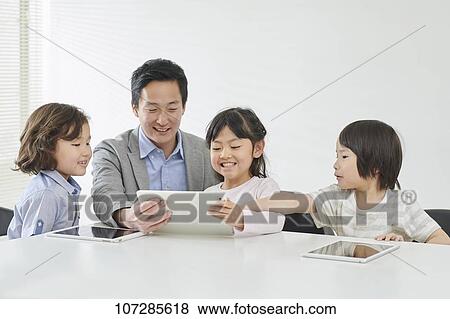 Japanese elementary school kids with teacher View Large Photo Image Stock Photo - Japanese elementary school kids with teacher. Fotosearch