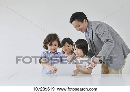 Japanese elementary school kids with teacher View Large Photo Image Stock Photo - Japanese elementary school kids with teacher. Fotosearch