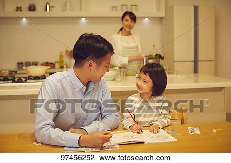Stock Image - Japanese family at home. Fotosearch