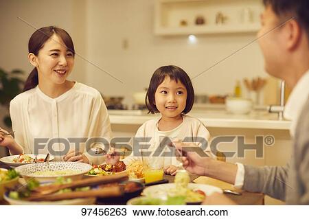 Stock Image - Japanese family at home. Fotosearch