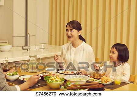 Stock Image - Japanese family at home. Fotosearch