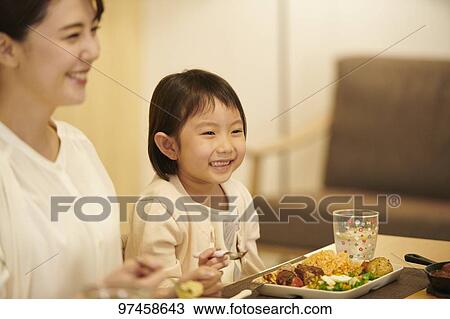 Stock Image - Japanese family at home. Fotosearch