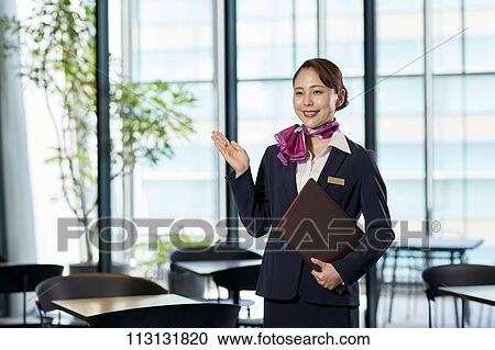 Stock Image - Japanese Flight Attendant. Fotosearch