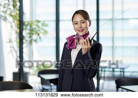 Stock Photo - Japanese Flight Attendant. Fotosearch