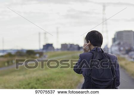 Stock Photo - Japanese high school student in uniform outdoors. Fotosearch