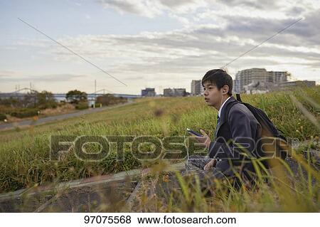 Japanese high school student in uniform outdoors View Large Photo Image Stock Photo - Japanese high school student in uniform outdoors. Fotosearch
