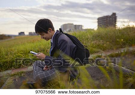 Japanese high school student in uniform outdoors View Large Photo Image Stock Photograph - Japanese high school student in uniform outdoors. Fotosearch