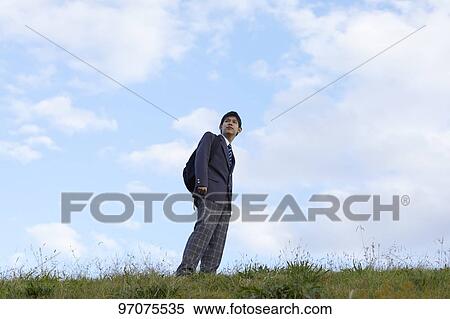 Stock Photography - Japanese high school student in uniform outdoors. Fotosearch