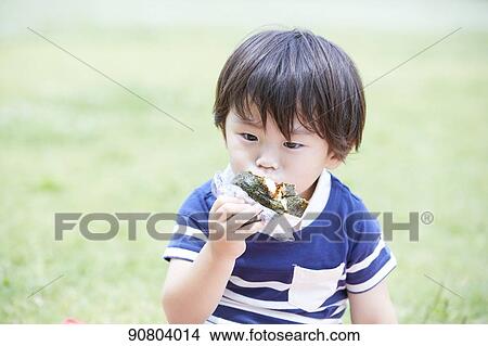 Picture - Japanese kid at a city park. Fotosearch