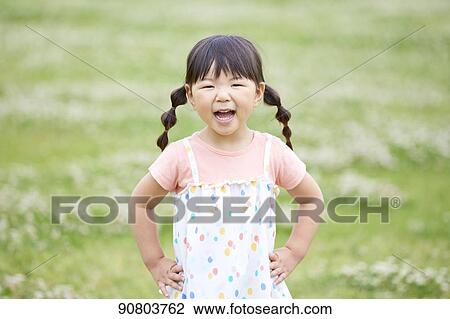 Stock Image - Japanese kid at a city park. Fotosearch