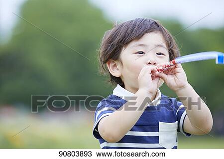 Japanese kid at a city park View Large Photo Image Stock Image - Japanese kid at a city park. Fotosearch