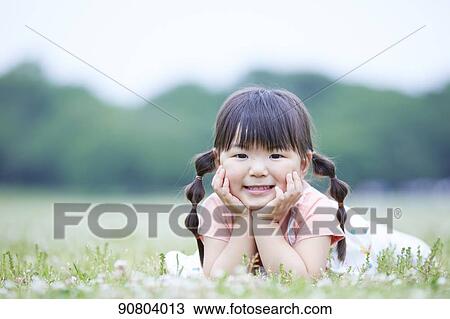 Japanese kid at a city park View Large Photo Image Stock Image - Japanese kid at a city park. Fotosearch