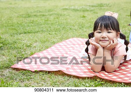 Japanese kid at a city park View Large Photo Image Stock Image - Japanese kid at a city park. Fotosearch