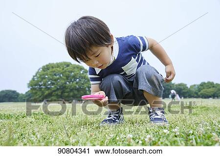 Japanese kid at a city park View Large Photo Image Stock Image - Japanese kid at a city park. Fotosearch